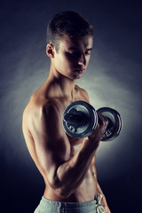 Fototapeta na wymiar young man with dumbbell