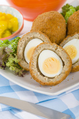Scotch Egg - Hard-boiled egg wrapped in sausage meat, coated in breadcrumbs and deep-fried.