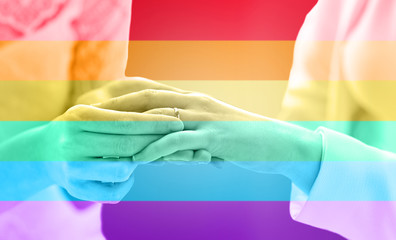 Fototapeta premium close up of lesbian couple hands with wedding ring
