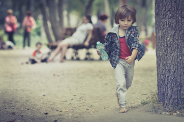 Fototapeta premium Cute young child boy or kid playing
