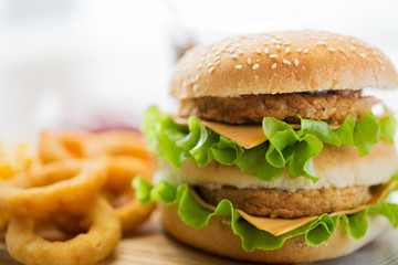 close up of hamburger or cheeseburger on table