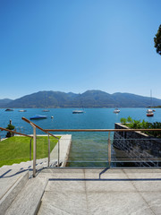Lake view from the balcony of modern villa, summer