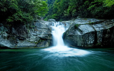 Fototapeta na wymiar Large rain forest waterfall