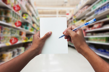 hand women shopping and  holding empty notebook for check list h