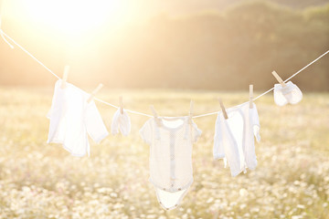 Baby laundry hanging on a clothesline
