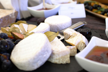 set of ingredients: cheese, olives, berries, sauces, snacks