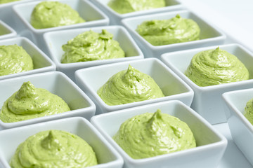 butter mixed with herbs in small plates at the buffet