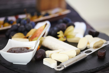 set of ingredients: cheese, olives, berries, sauces, snacks
