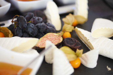set of ingredients: cheese, olives, berries, sauces, snacks