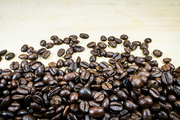 Coffee beans on wooden background