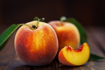 Naklejka na ściany i meble Fresh Peaches on Wooden Table