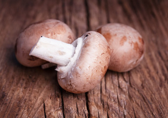 Organic chestnut  mushrooms on wooden rustic  background