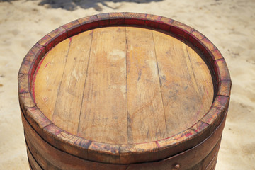 Fototapeta premium Wooden barrel on beach/Summer food background. Wooden background.