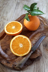 Juicy oranges with leaves