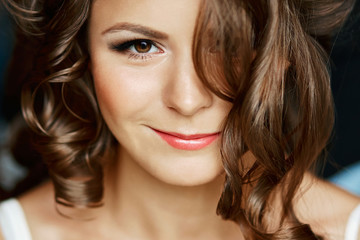 Obraz premium Close up over head beauty portrait of a young woman's half face