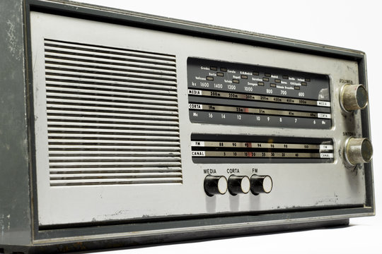 Old radio receiver on white