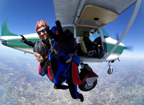 Skydiving Tandem jump with a small plane. Fisheye lens effect
