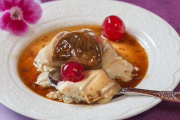 Panna cotta with cheries, caramel and wafer