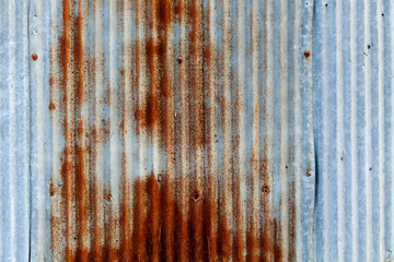 A background of peeling paint and rusty old metal