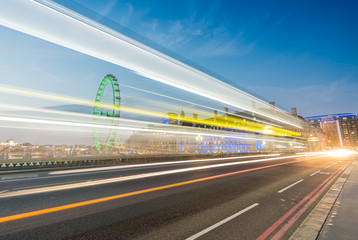 Fototapeta na wymiar LONDON - JUNE 13, 2015: Light trails across Westminster Bridge w