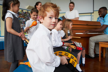 Group Of Children Playing In School Orchestra Together