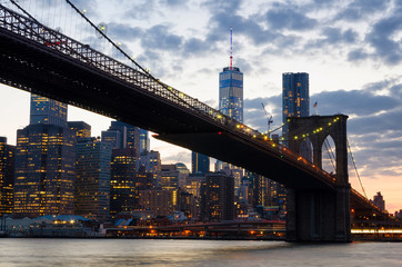 Fototapeta na wymiar Brooklyn Bridge over East River at night in New York City