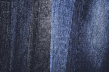 Jeans hanging vertically on a hanger. full frame. horizontal