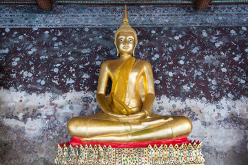 Buddha statue on pattern grunge background.