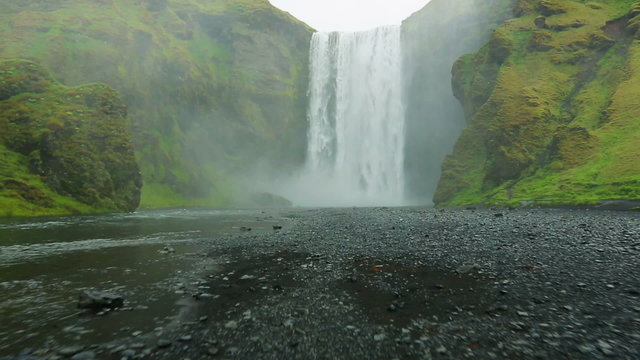 Drone Video of Big Powerful Waterfall with Lots of Water Spray. Skogafoss, Iceland. 