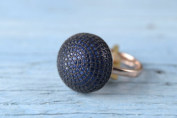 Jewelry ring on old wooden table