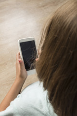 Girl touching a smartphone