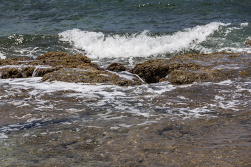 Sea wave hit the rock