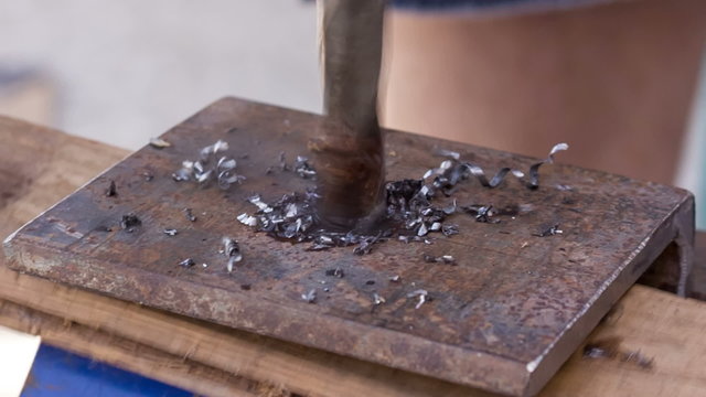 drilling holes in a metal workpiece 