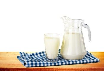 Milk, glass, tablecloth.