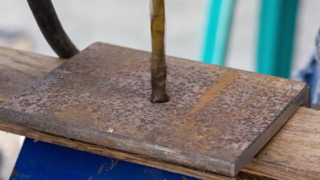 drilling holes in a metal blank