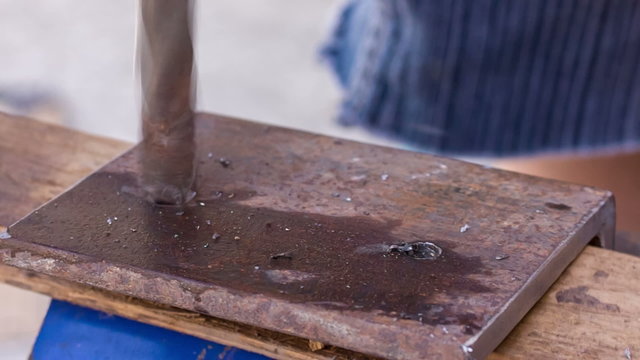 drilling holes in a metal workpiece