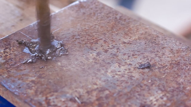 drilling holes in a metal workpiece