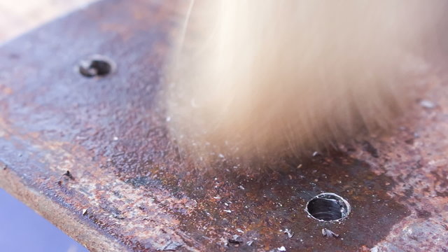 drilling holes in a metal workpiece