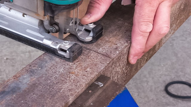 cutting metal blank using jigsaw 