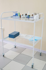Mobile little table with medical accessories
