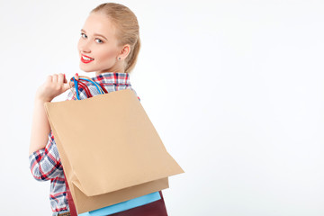 Fototapeta premium Cheerful young girl is purchasing in boutique