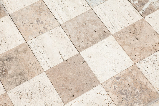 Close Up Of A Large Stone Tile Floor Into The Distance