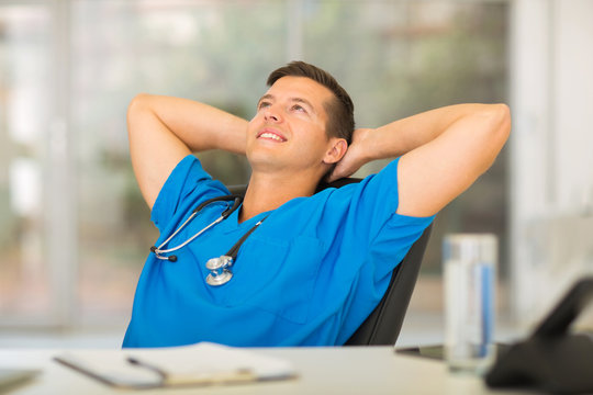 Medical Doctor Relaxing In Office