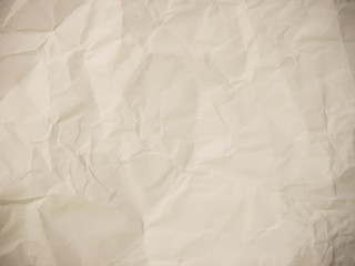 Crumpled paper texture pattern background in light white color t