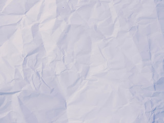 Crumpled paper texture pattern background in light pale blue col