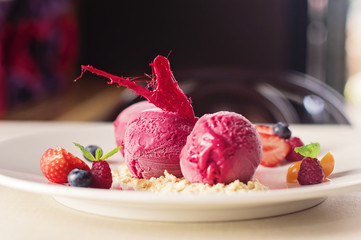 Ice cream scoops with fresh berries