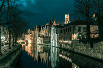 Night tower Belfort and the Green canal in Bruges