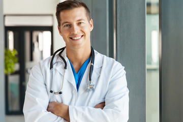 young male doctor looking at the camera