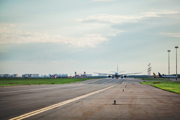 Fototapeta na wymiar Airplane taxing on the runway