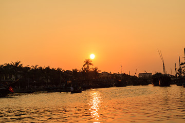 Fototapeta premium Sunset on river at Hoi An old town, Vietnam